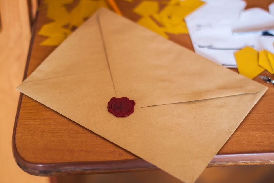 Envelope and correspondence on a desk