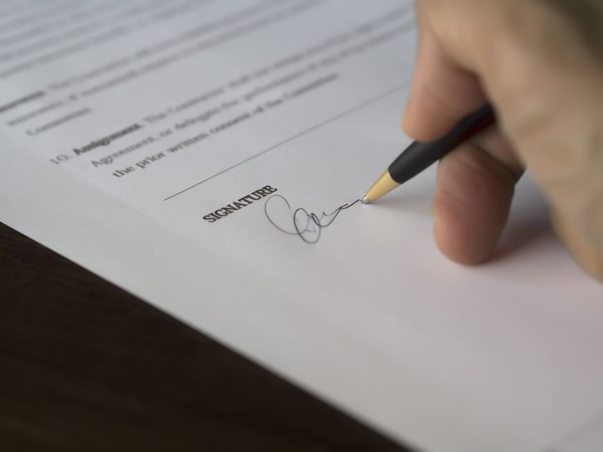 Signing a settlement agreement with a pen
