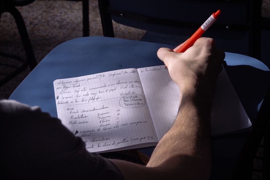 Writing notes in a notebook