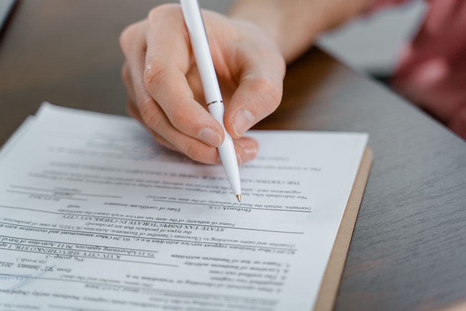 Completing paperwork at a desk
